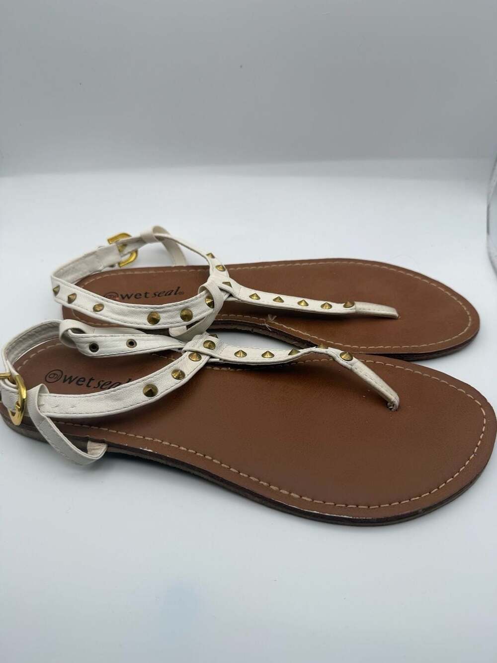Wet Seal White Gold Studded T-Strap Flat Sandals